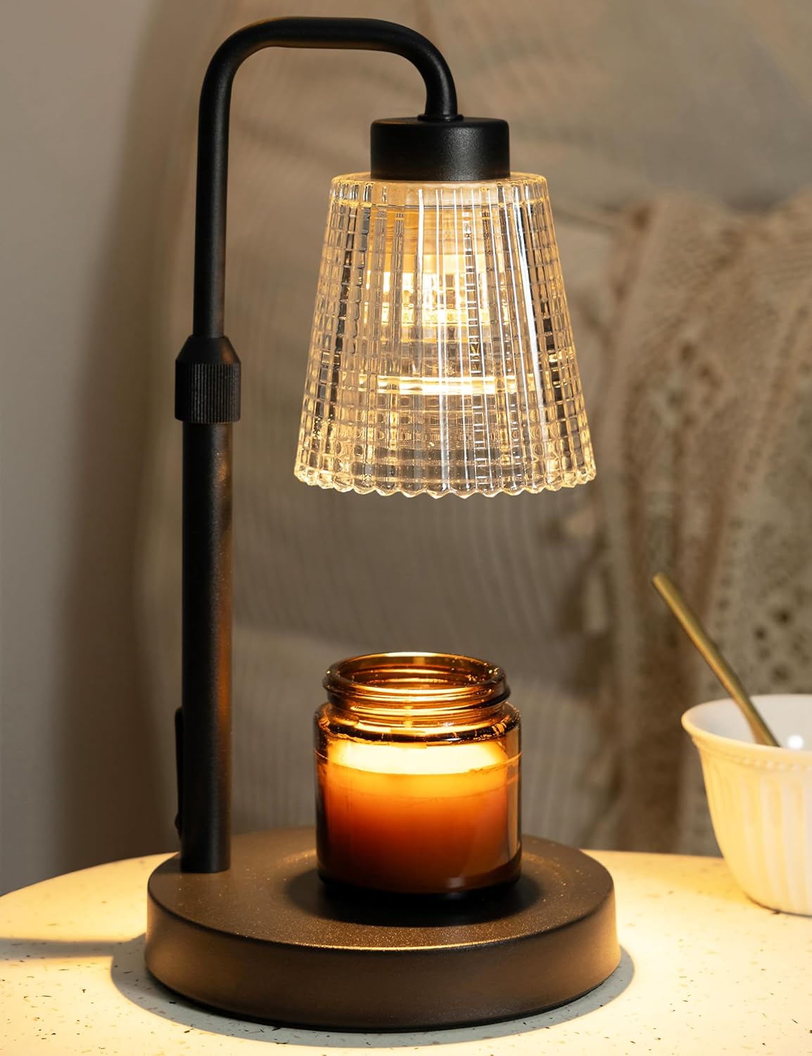GODONLIF candle warmer lamp in black with dimmable light glowing over a jar candle