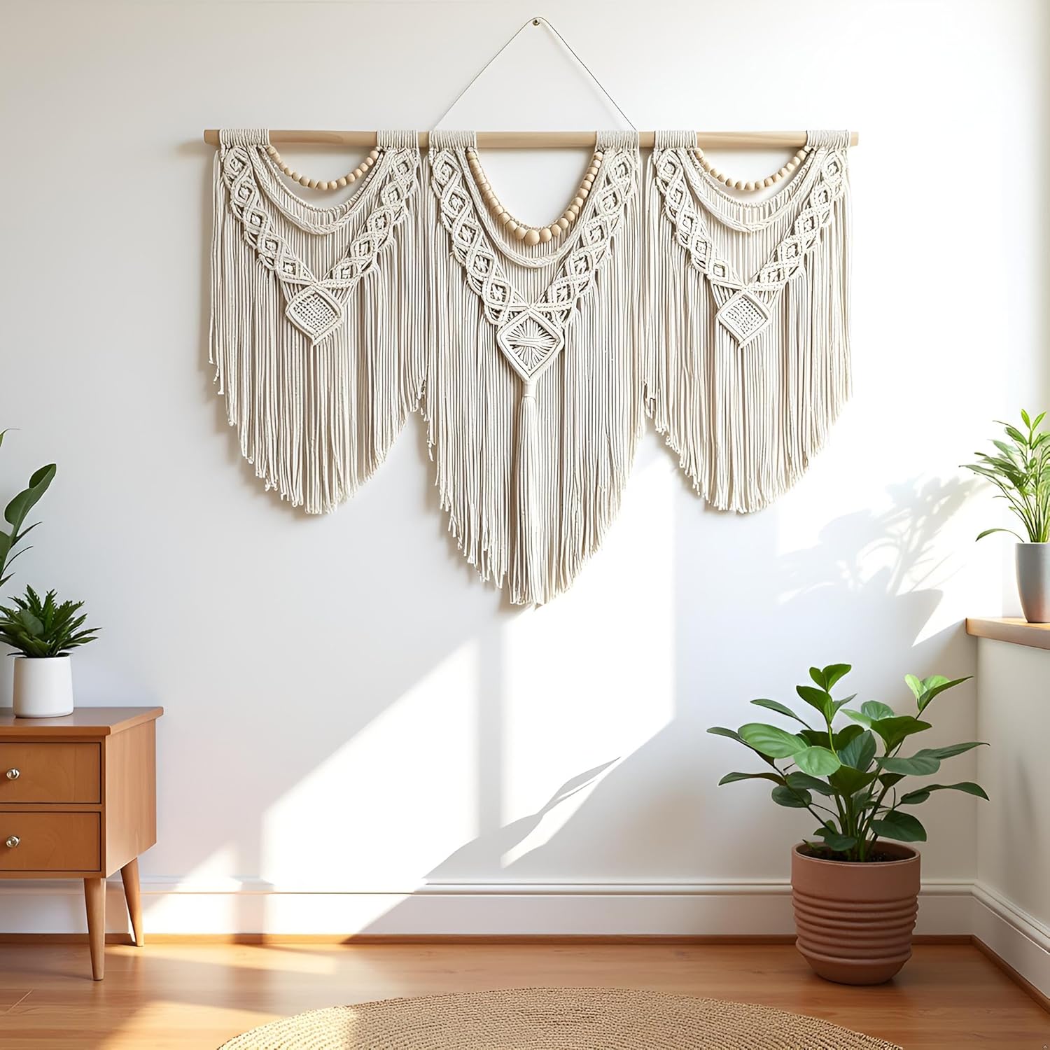 Bohemian macrame wall hanging styled above a bed as bedroom wall decor with neutral boho interior