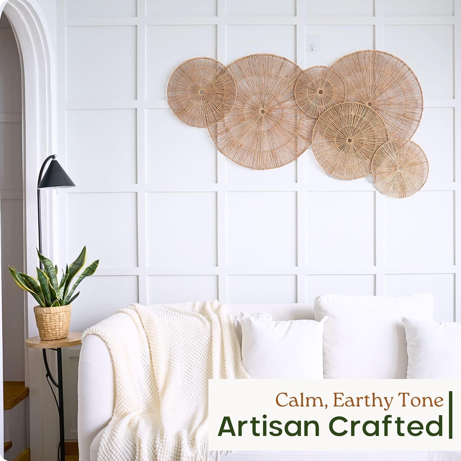 Boho wicker wall baskets arranged in a living room gallery wall display